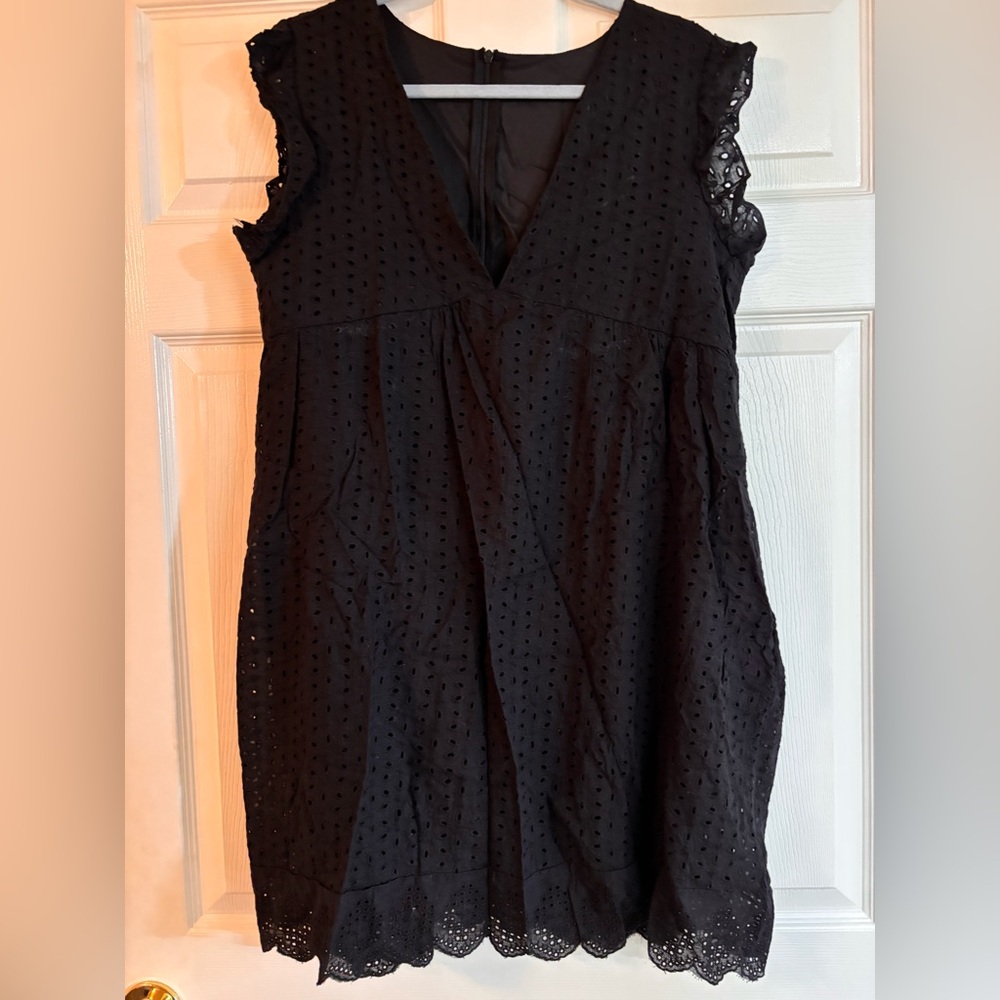 Black Eyelet Sleeveless Dress. Has built in shorts. Fits like a romper